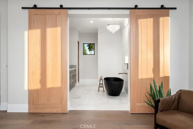 a bedroom with a large bed and a dresser