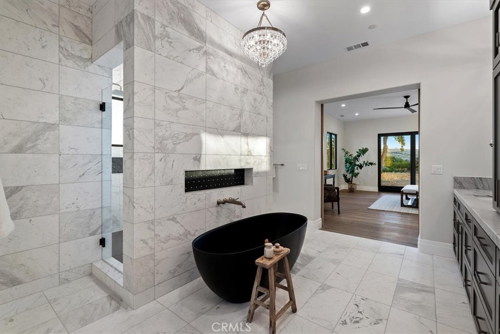 1410 Fire Rock Loop Templeton, CA 93465 - Photo 28 of 64 a view of a livingroom with furniture and a flat screen tv