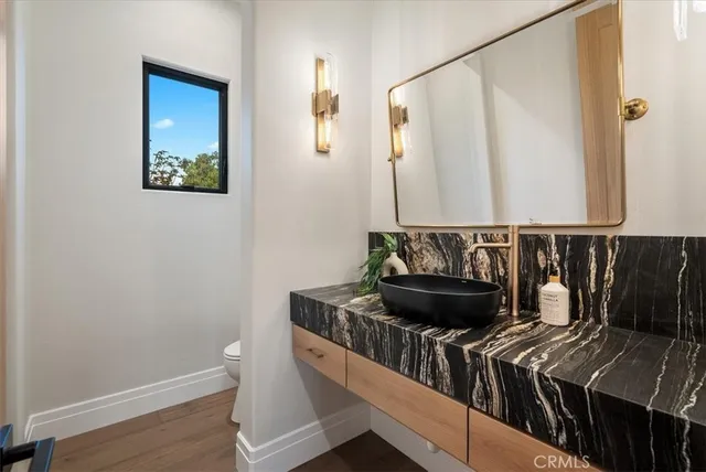 a bathroom with a double vanity sink and mirror
