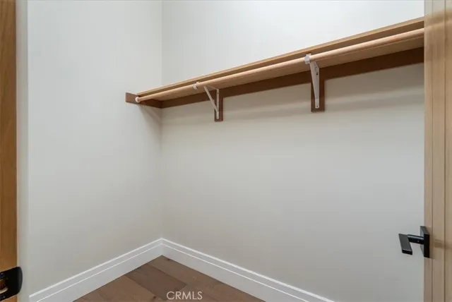 a living room with couch and a floor to ceiling window