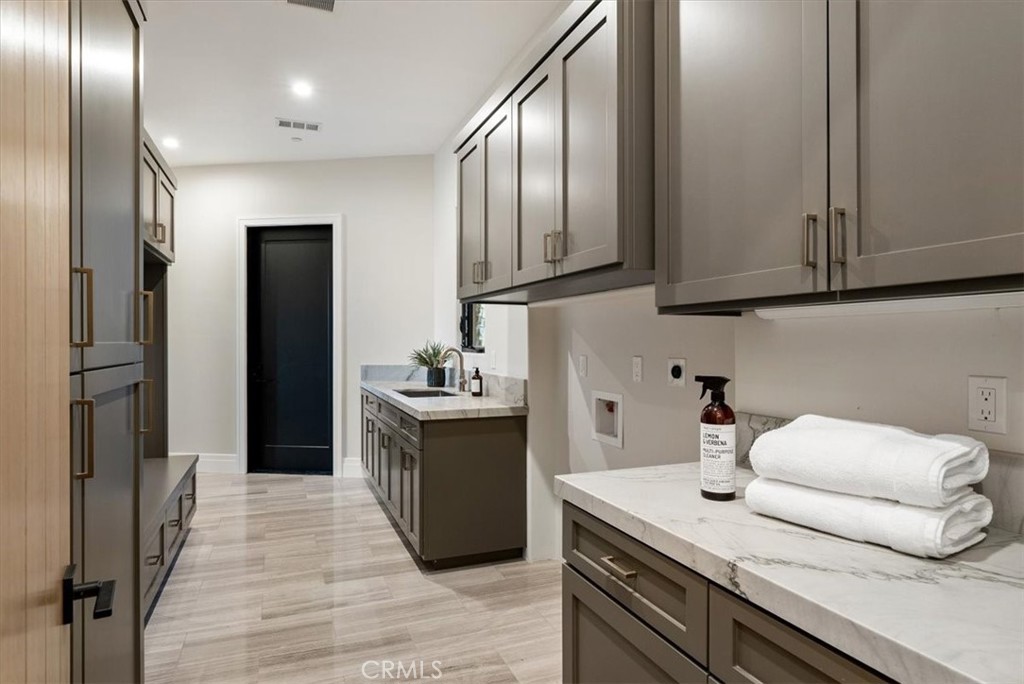 1410 Fire Rock Loop Templeton, CA 93465 - Photo 45 of 64 a kitchen with a sink and refrigerator