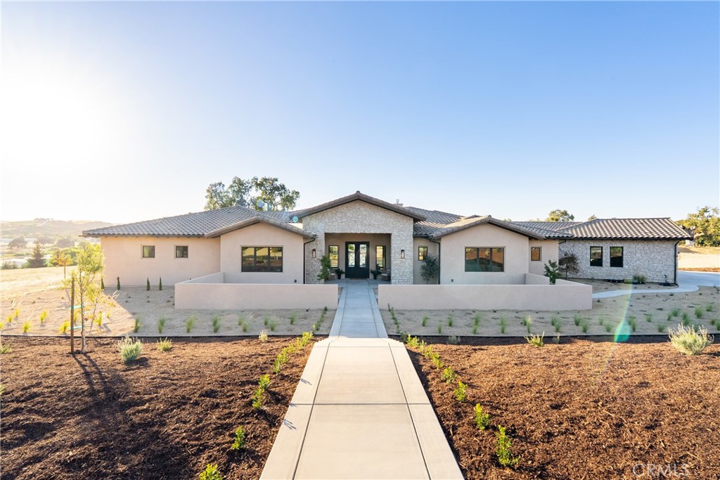 1410 Fire Rock Loop Templeton, CA 93465 - Photo 64 of 64 a front view of a house with a yard and garage