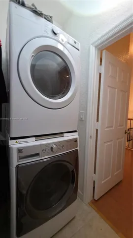 a view of a livingroom with furniture and windows