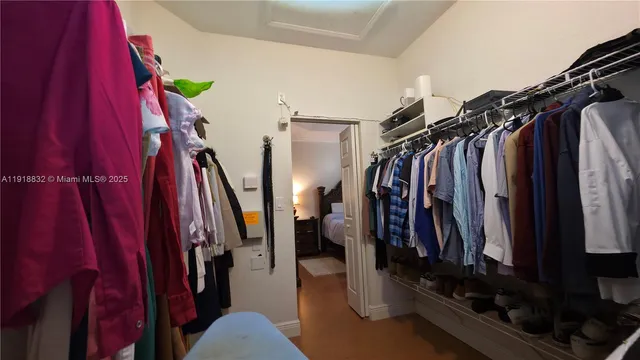 a bathroom with a mirror sink and vanity