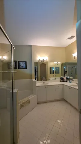 a view of a hallway with seating area