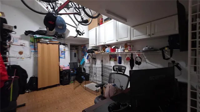 a front view of a house with a yard and potted plants