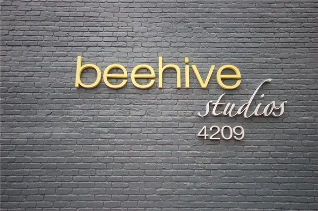 a sign that is on a brick wall