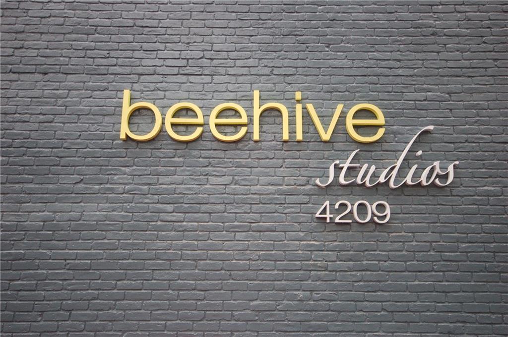 4209 Avenue B, Unit 110 Austin, TX 78751 - Photo 9 of 10 a sign that is on a brick wall