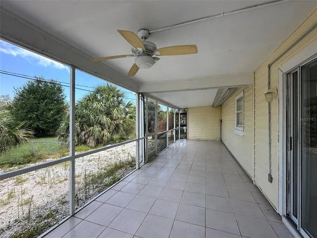 a backyard of a house with outdoor seating