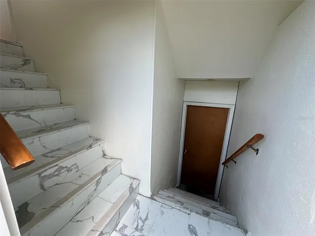 a kitchen with a stove a sink and a window