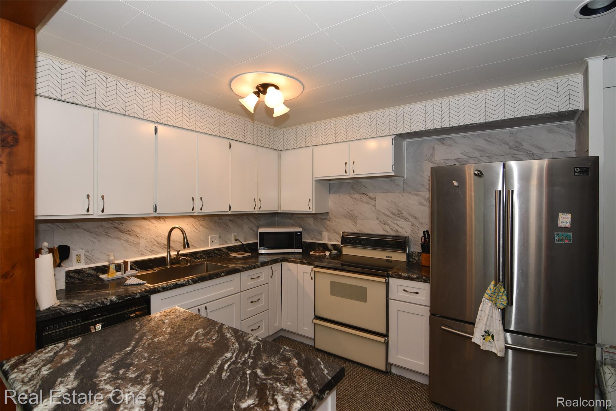 4255 Ash Road Lincoln, MI 48742 - Photo 21 of 41 Island in Kitchen is mobile