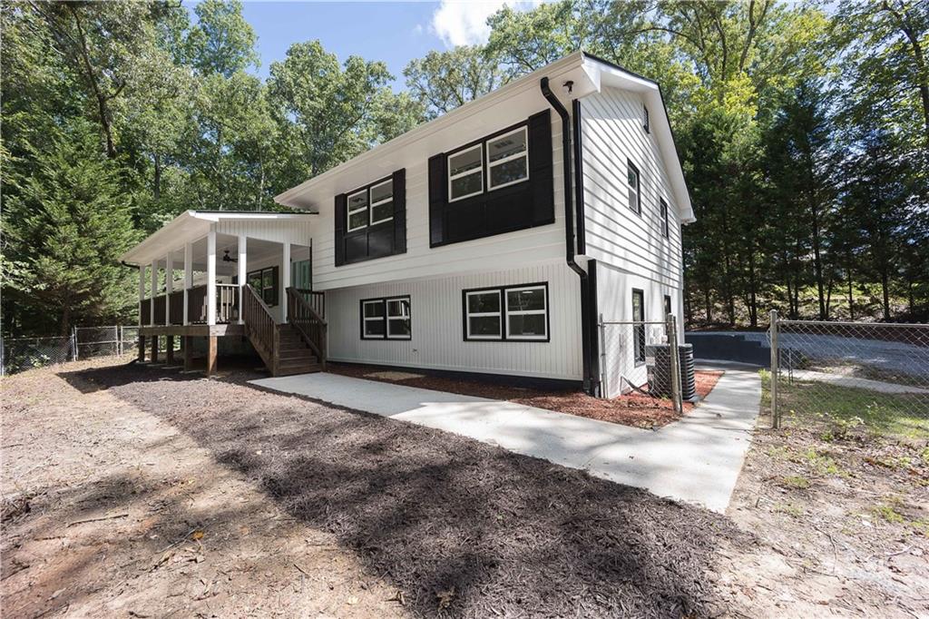 1491 Cole Creek Road Dallas, GA 30157 - Photo 1 of 1 a front view of a house with a yard