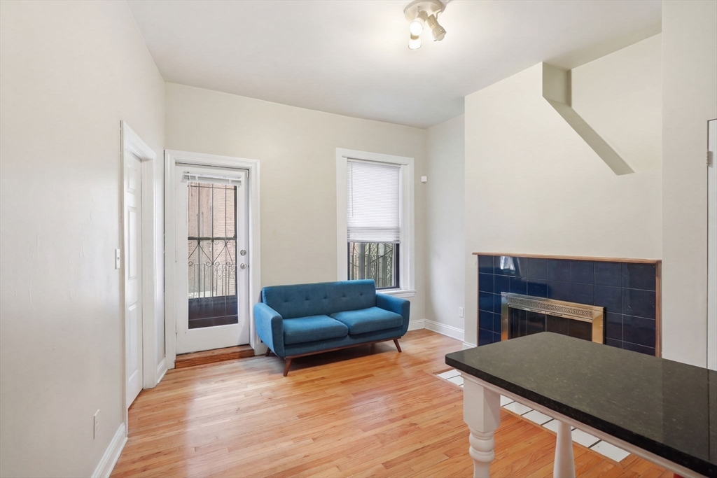 20 Symphony Road, Unit 2 Boston, MA 02115 - Photo 1 of 11 a living room with furniture and a fireplace