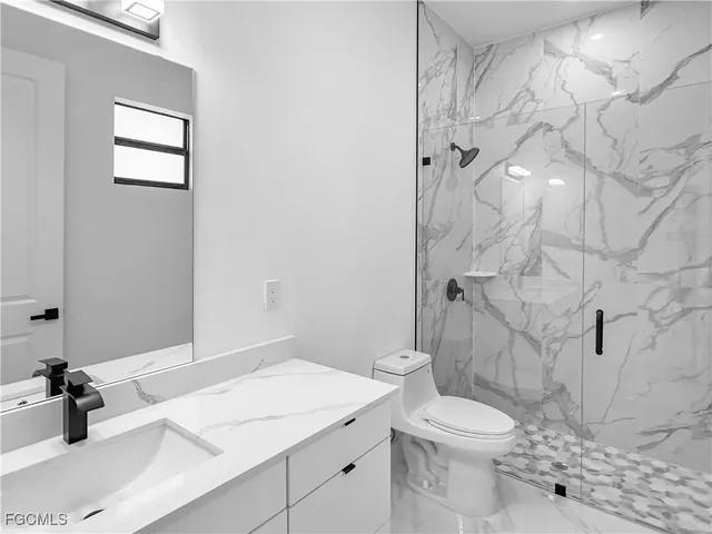 an empty room with a painting on the wall