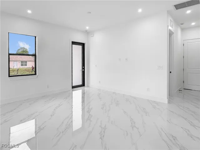 an empty room with windows