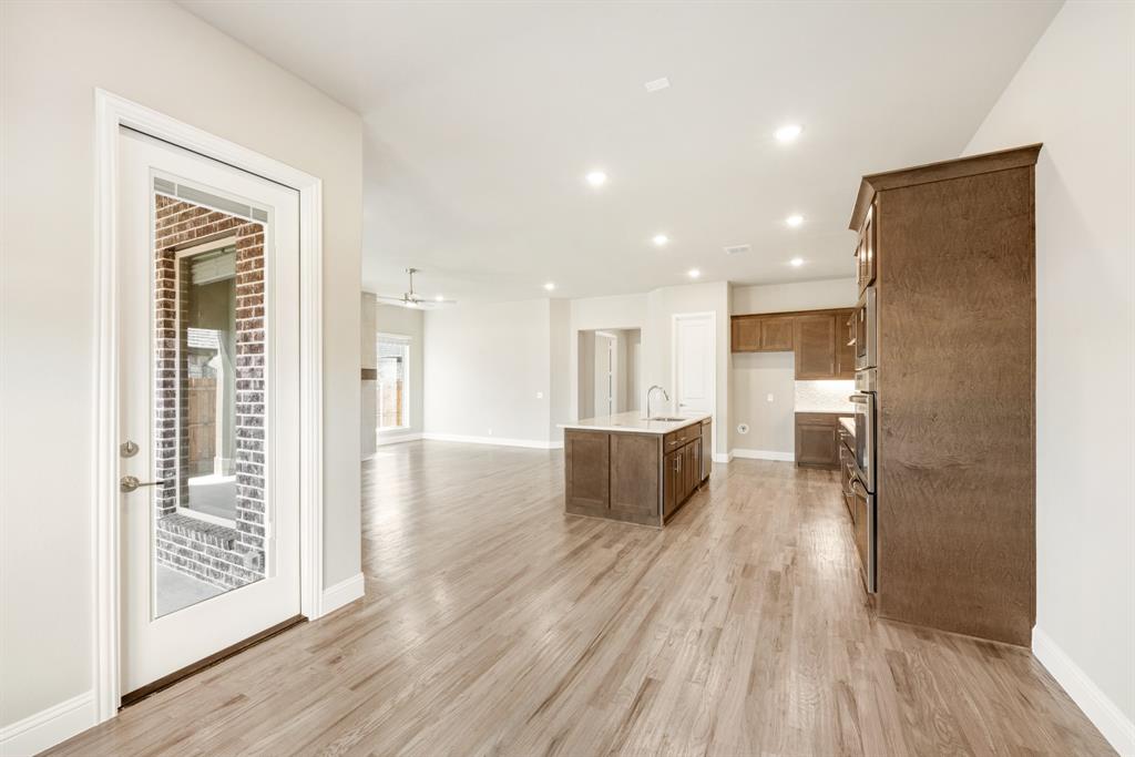 1004 Stonehaven Drive Justin, TX 76247 - Photo 18 of 35 a view of kitchen with furniture and wooden floor