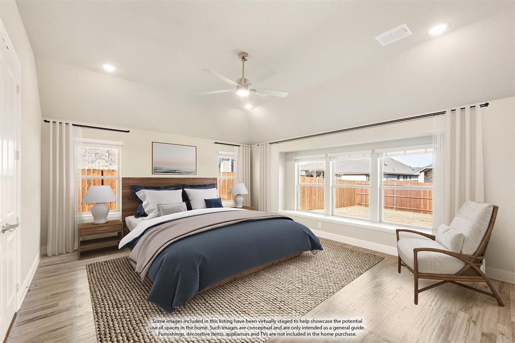 1004 Stonehaven Drive Justin, TX 76247 - Photo 21 of 35 a bedroom with a bed and a chair