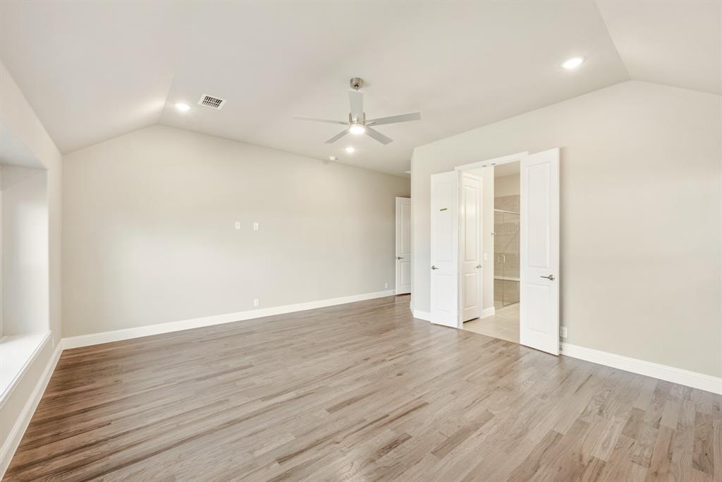 1004 Stonehaven Drive Justin, TX 76247 - Photo 22 of 35 wooden floor in an empty room with a window