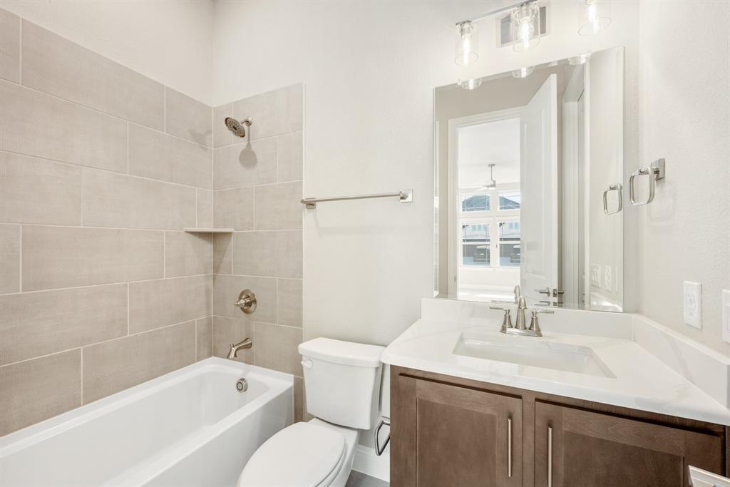 1004 Stonehaven Drive Justin, TX 76247 - Photo 27 of 35 a bathroom with a sink toilet tub and shower