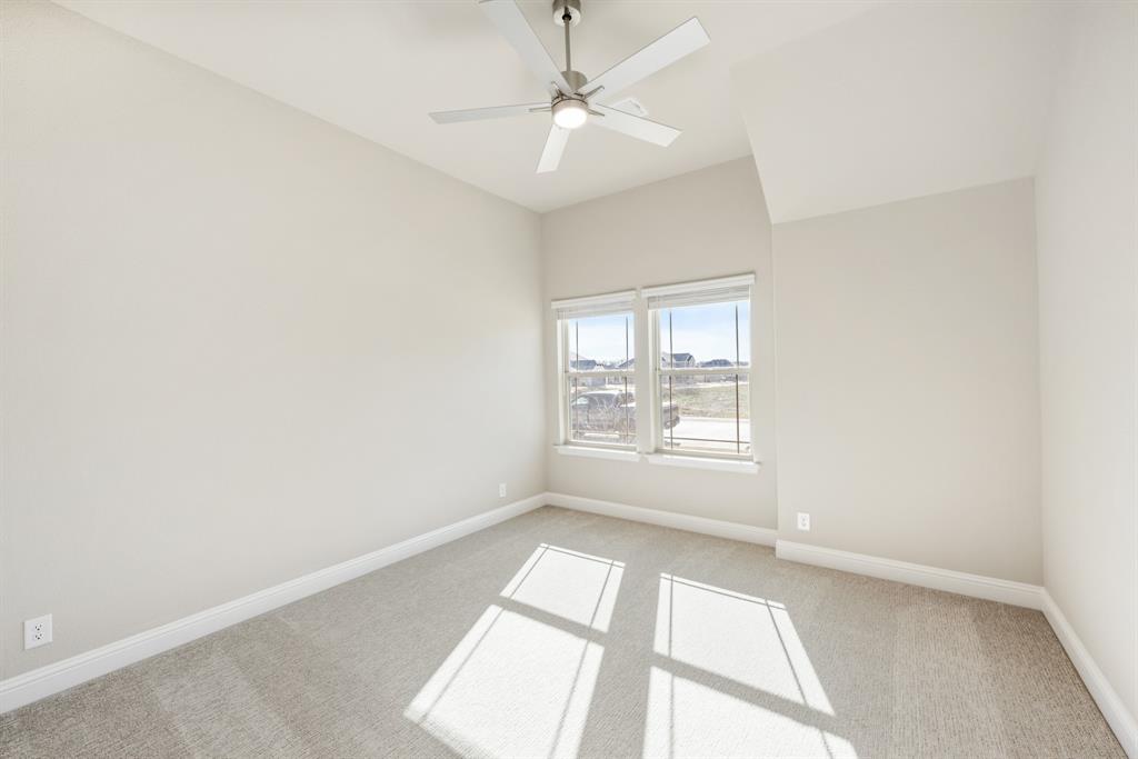 1004 Stonehaven Drive Justin, TX 76247 - Photo 28 of 35 an empty room with windows and ceiling fan