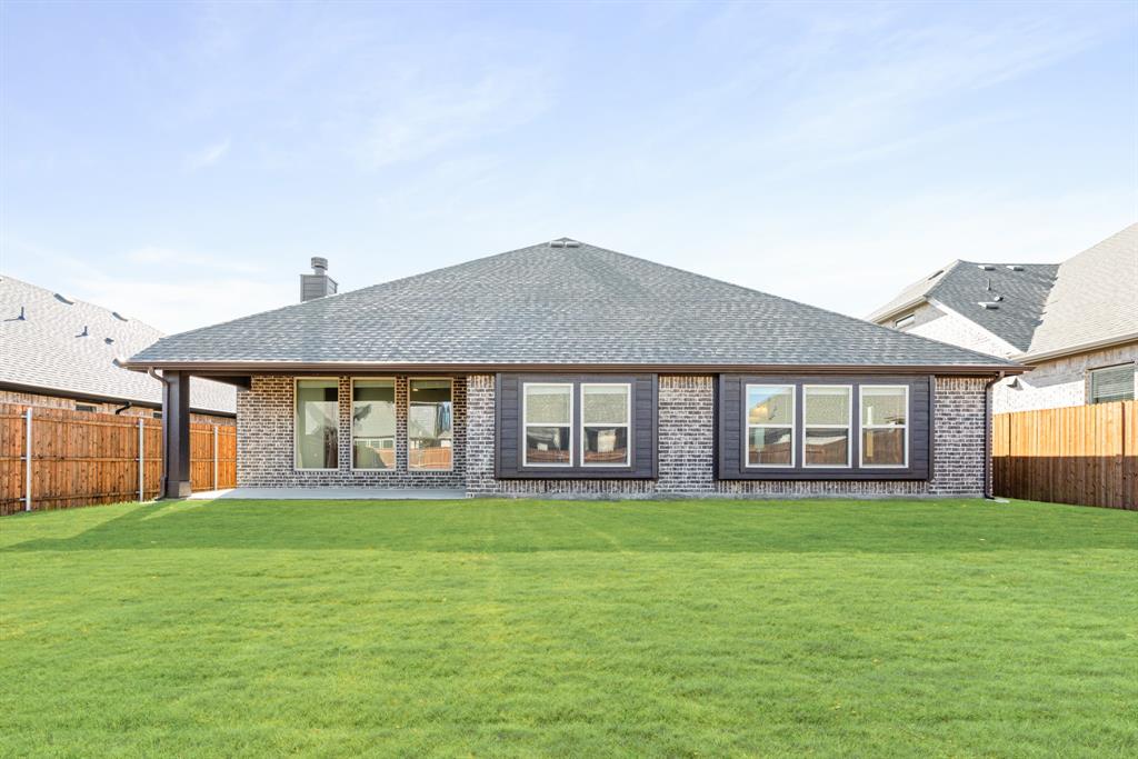 1004 Stonehaven Drive Justin, TX 76247 - Photo 33 of 35 a house view with a garden space