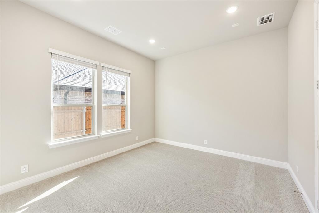 1004 Stonehaven Drive Justin, TX 76247 - Photo 9 of 35 an empty room with a window
