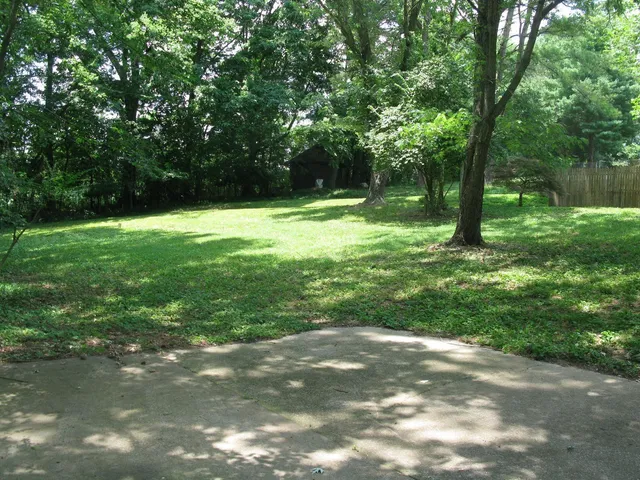 a view of outdoor space with deck and yard