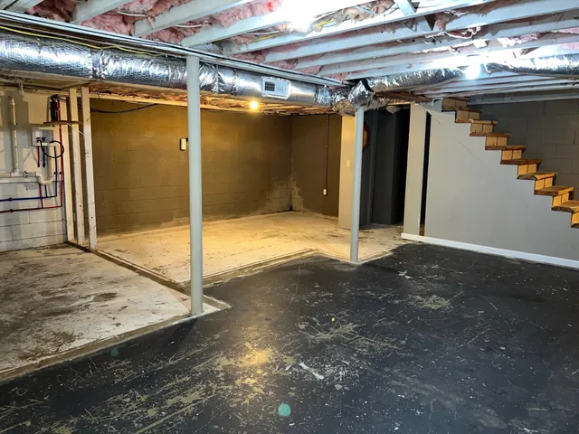 a view of a room with wooden floor