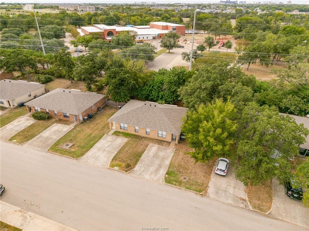 an aerial view of residential house with outdoor space and parking