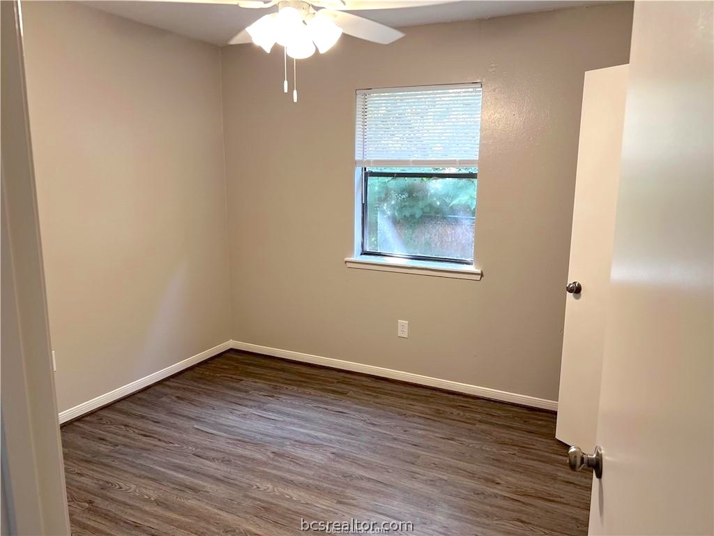 625 West Ridge Drive College Station, TX 77845 - Photo 11 of 13 an empty room with wooden floor and windows