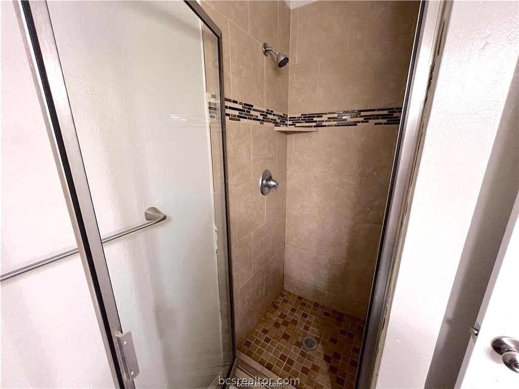 625 West Ridge Drive College Station, TX 77845 - Photo 9 of 13 a bathroom with a shower and a sink