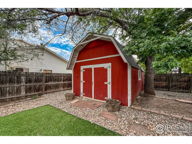 a view of a park with large trees