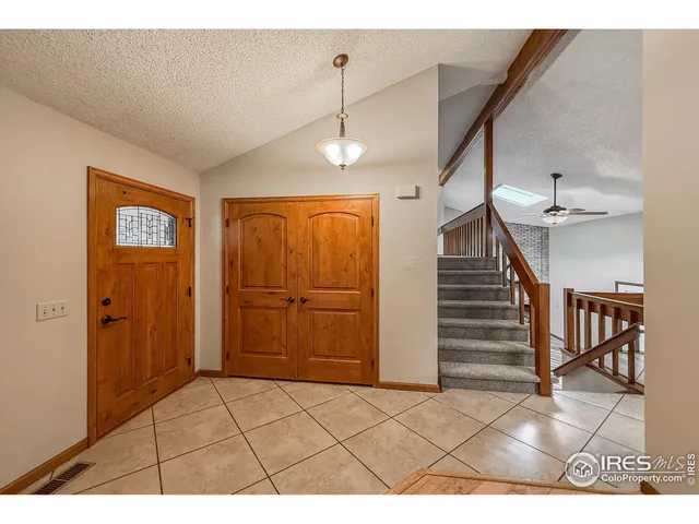 a view interior of a house with wooden floor windows and entryway