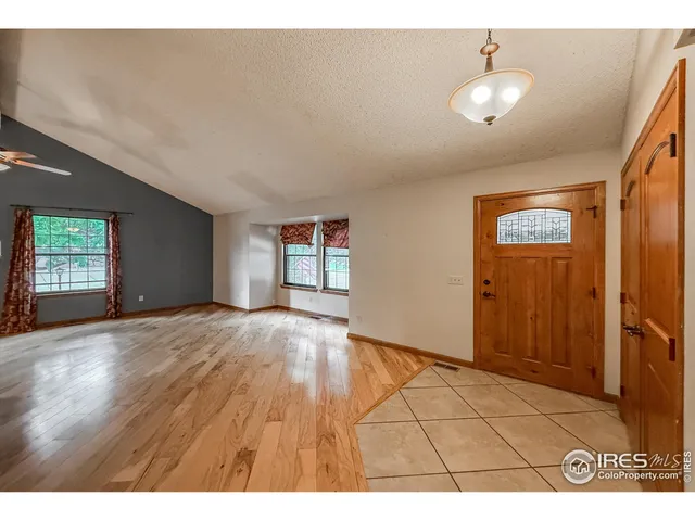 a view of an empty room and window