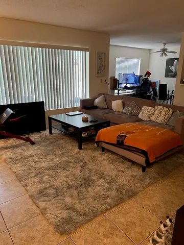 a living room with furniture and a table