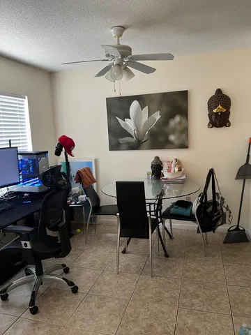 a view of a workspace with furniture