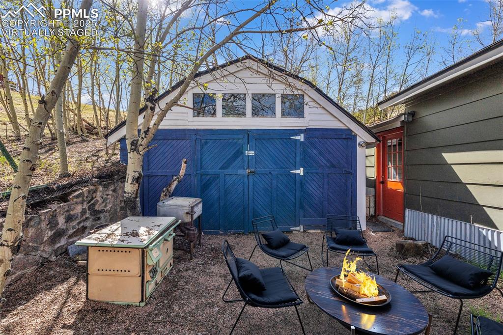 123 7th Street Victor, CO 80860 - Photo 45 of 50 Virtually Staged Back yard with access to Garage