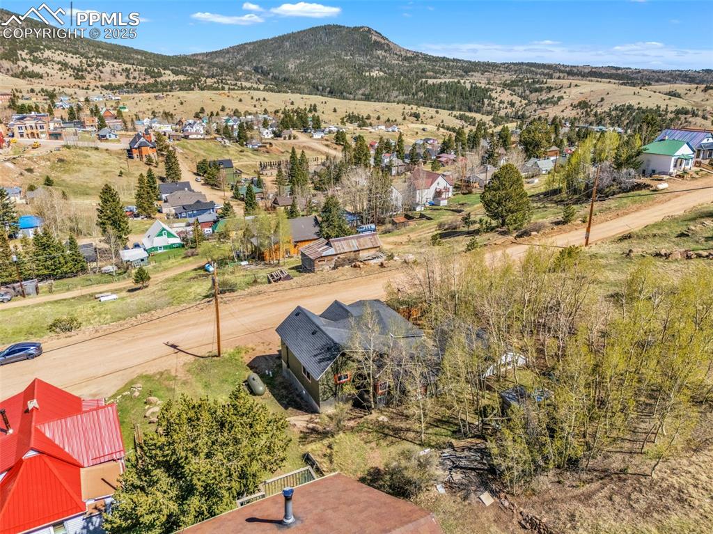 123 7th Street Victor, CO 80860 - Photo 48 of 50 Aerial view of residential area with a mountain backdrop