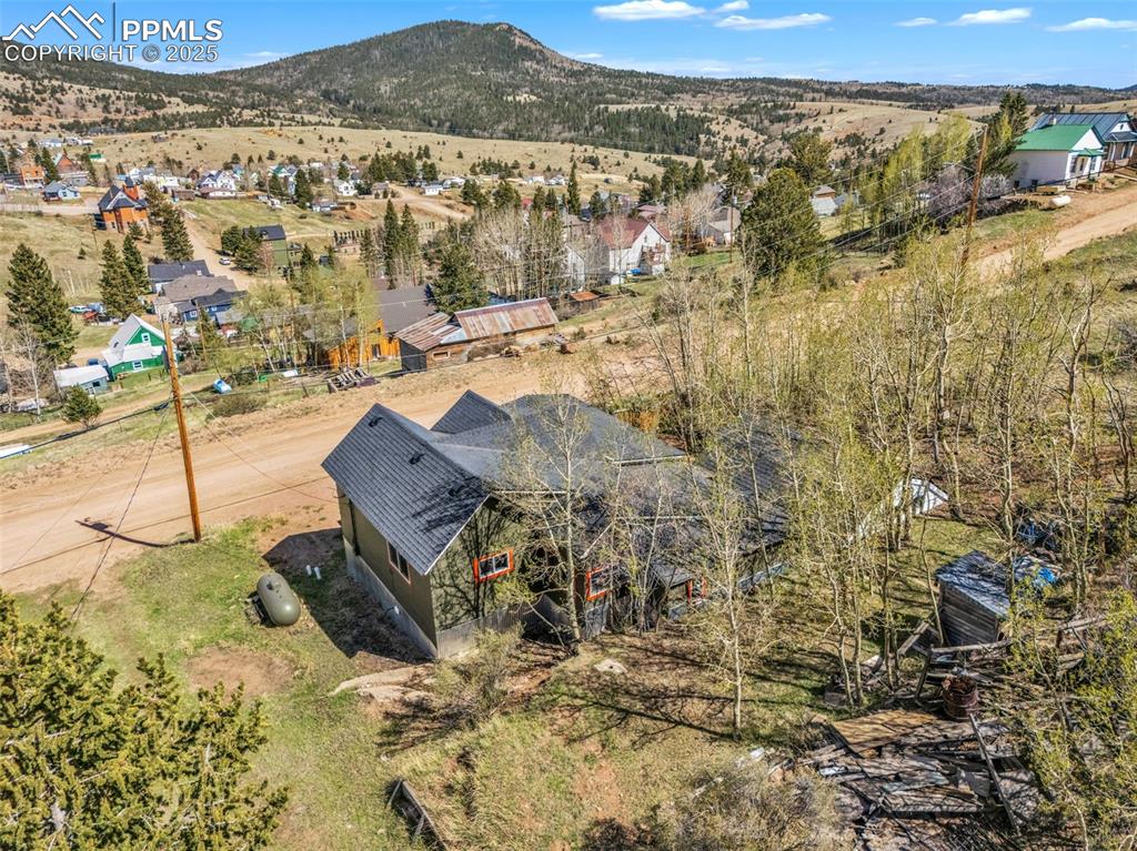 123 7th Street Victor, CO 80860 - Photo 5 of 50 View from above of property featuring treed lot and views of Victor and adjacent mountains
