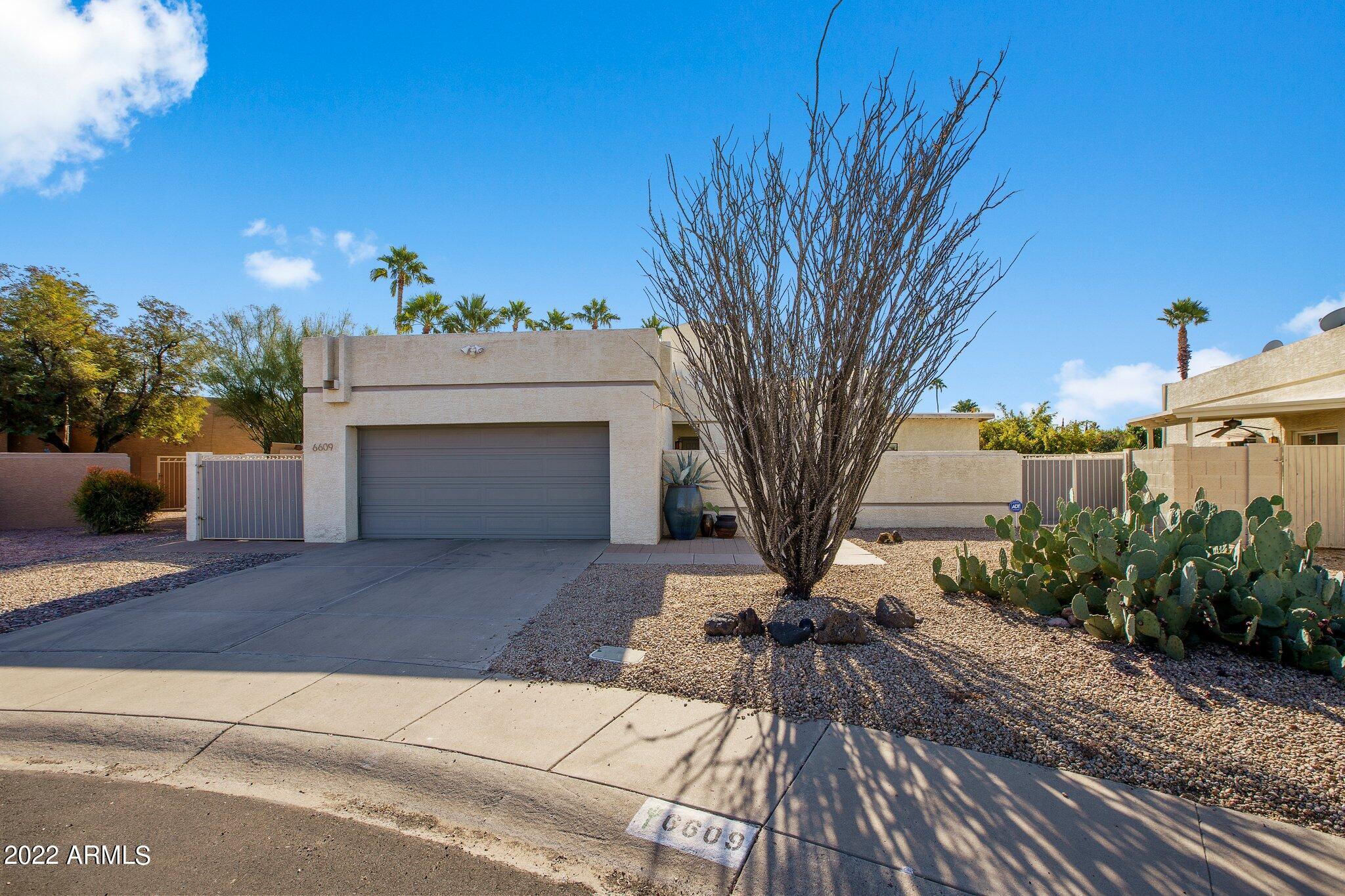 6609 East Phelps Road Scottsdale, AZ 85254 - Photo 38 of 83 a view of a house with a yard