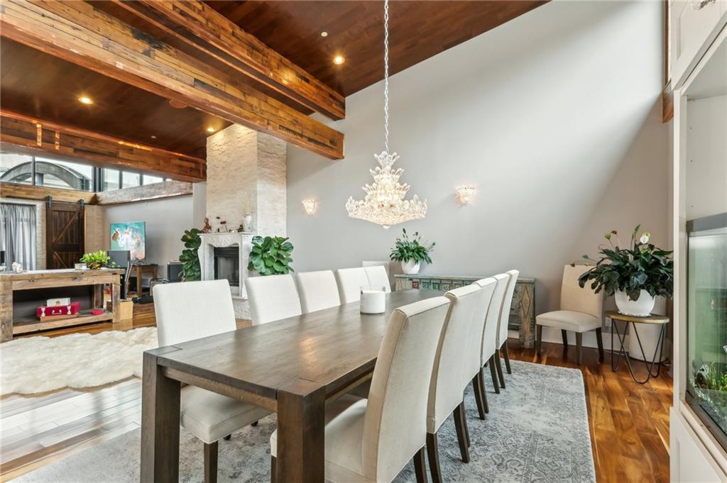 215 25th Street, Unit 7 Pittsburgh, PA 15222 - Photo 12 of 49 a view of a dining room with furniture and a chandelier