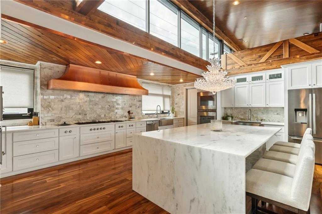 215 25th Street, Unit 7 Pittsburgh, PA 15222 - Photo 16 of 49 a kitchen with stainless steel appliances granite countertop a sink and cabinets