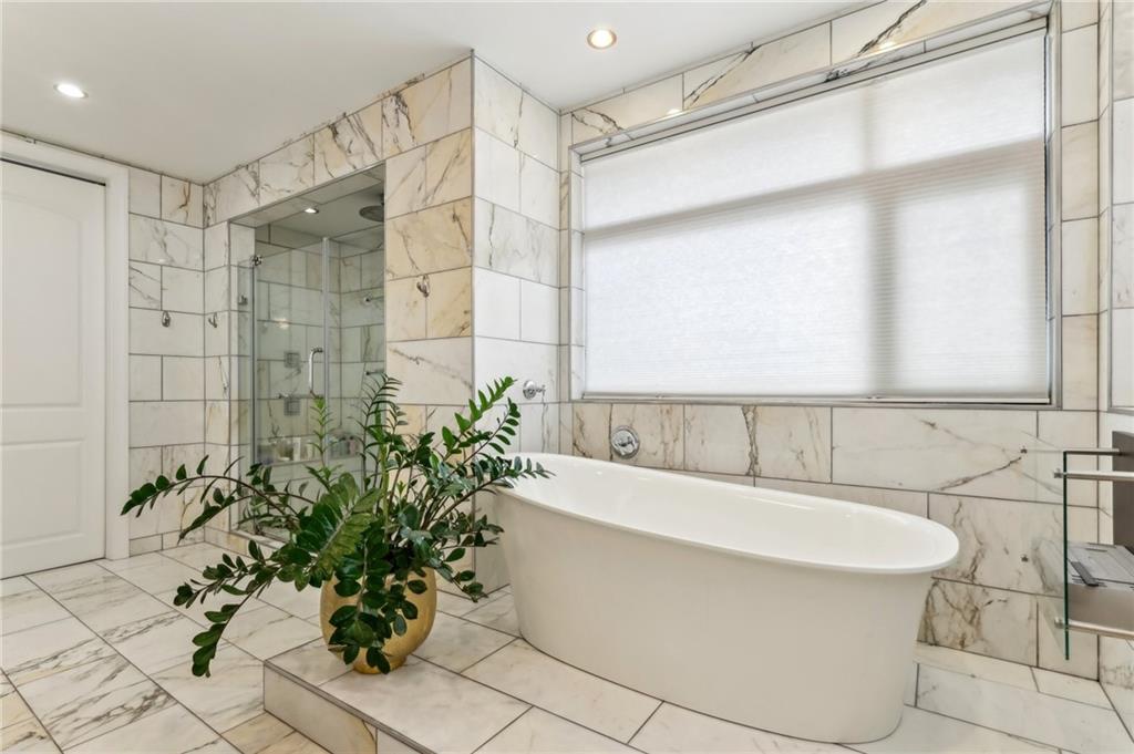 215 25th Street, Unit 7 Pittsburgh, PA 15222 - Photo 24 of 49 a bathroom with a bathtub and a shower