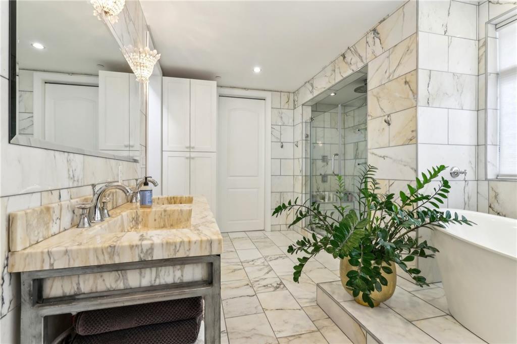 215 25th Street, Unit 7 Pittsburgh, PA 15222 - Photo 27 of 49 a bathroom with a sink and a mirror