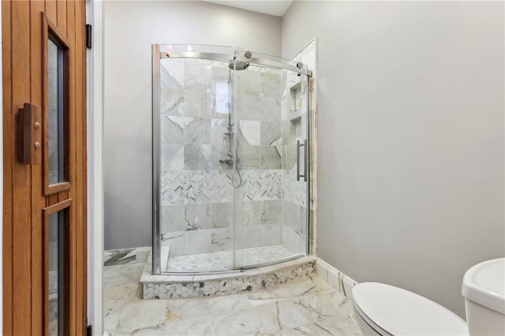 215 25th Street, Unit 7 Pittsburgh, PA 15222 - Photo 30 of 49 a bathroom with a shower and toilet