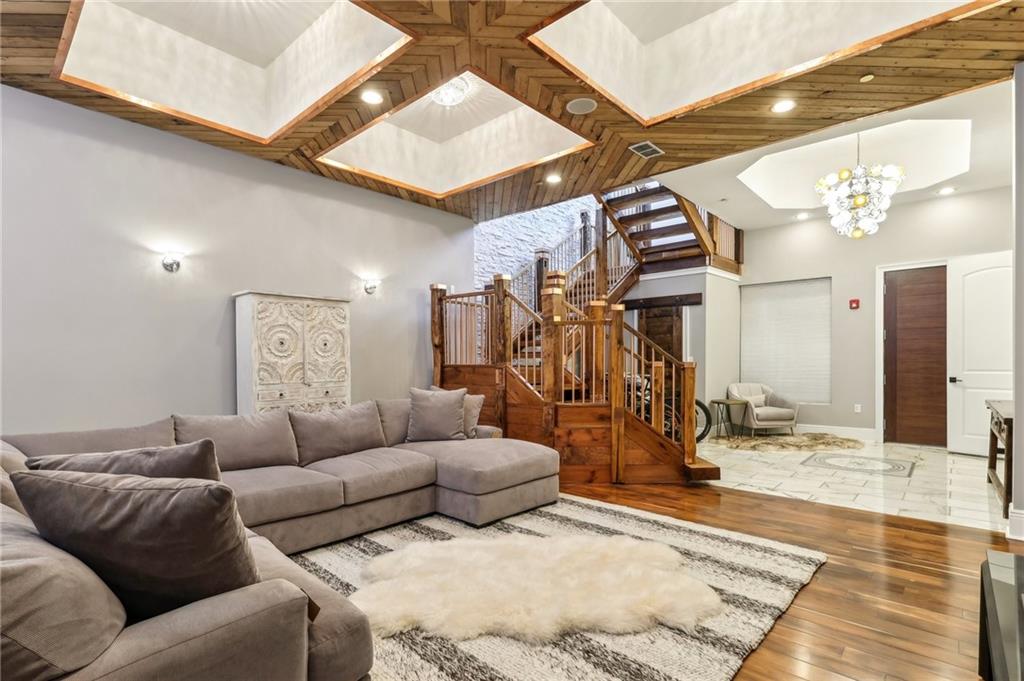 215 25th Street, Unit 7 Pittsburgh, PA 15222 - Photo 3 of 49 a living room with furniture and a rug