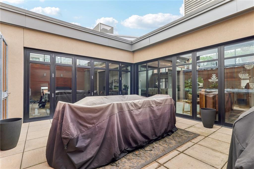 215 25th Street, Unit 7 Pittsburgh, PA 15222 - Photo 38 of 49 a bed sitting in front of a window