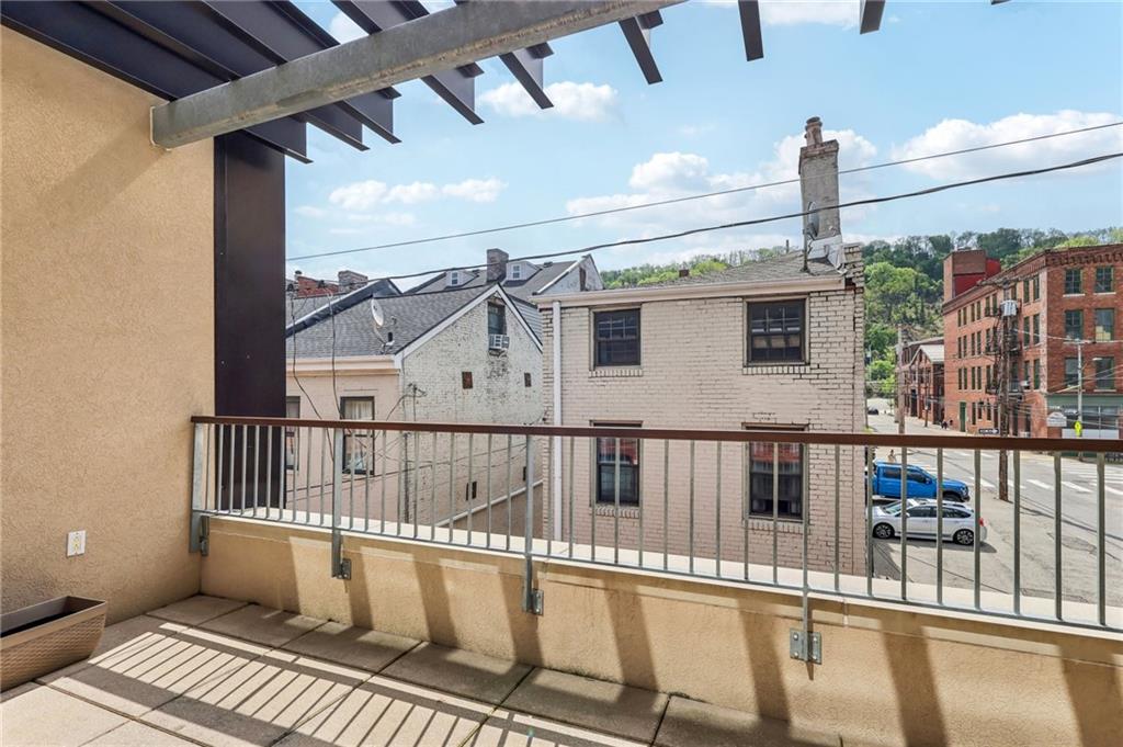 215 25th Street, Unit 7 Pittsburgh, PA 15222 - Photo 42 of 49 a view of a balcony with wooden floor