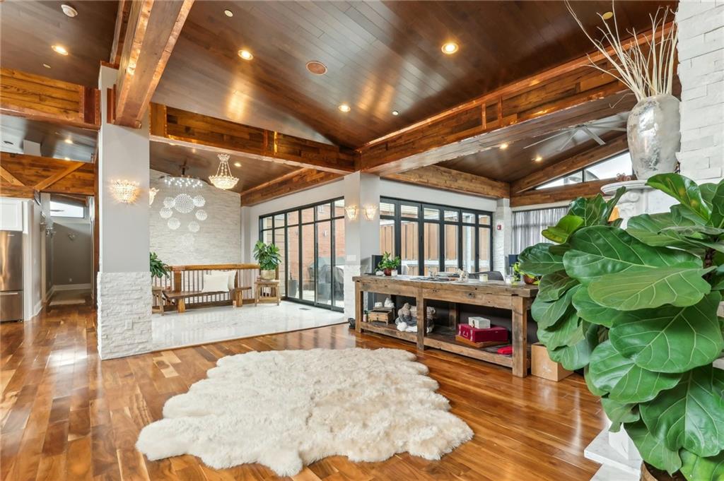 215 25th Street, Unit 7 Pittsburgh, PA 15222 - Photo 5 of 49 a living room with furniture a fireplace and wooden floor