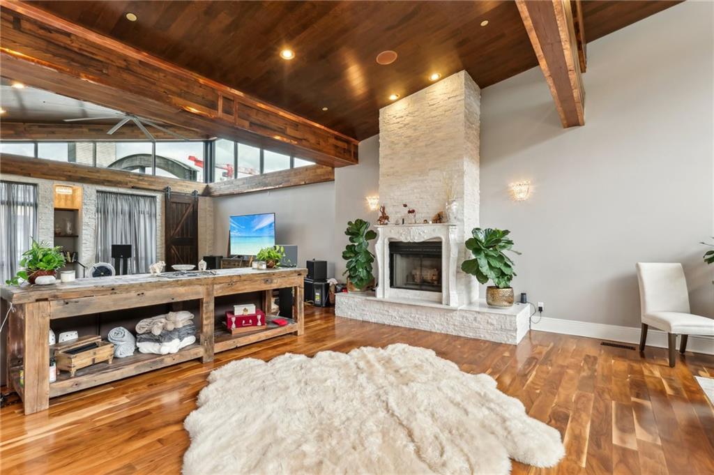 215 25th Street, Unit 7 Pittsburgh, PA 15222 - Photo 6 of 49 a living room with furniture and a fireplace